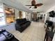 Screened porch with comfortable seating and a view of the backyard at 20102 Lorenzo Ave, Port Charlotte, FL 33952