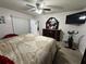 King-size bed in a well-lit bedroom with large TV at 20102 Lorenzo Ave, Port Charlotte, FL 33952