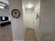 Clean hallway with tile floors and a view into the living room at 20102 Lorenzo Ave, Port Charlotte, FL 33952