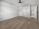 Spacious bedroom with neutral carpeting and ceiling fan at 7526 Fairlinks Ct, Sarasota, FL 34243