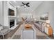 Spacious living room with fireplace and hardwood floors at 7526 Fairlinks Ct, Sarasota, FL 34243
