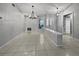 Bright dining room with tile floors and chandelier at 7526 Fairlinks Ct, Sarasota, FL 34243