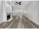 Bright living room with hardwood floors and fireplace at 7526 Fairlinks Ct, Sarasota, FL 34243