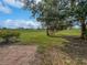 Landscaped backyard with view of golf course at 7526 Fairlinks Ct, Sarasota, FL 34243