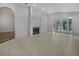 Spacious living room with fireplace and tile floors at 7526 Fairlinks Ct, Sarasota, FL 34243