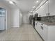 Modern kitchen with white cabinets and granite countertops at 7526 Fairlinks Ct, Sarasota, FL 34243