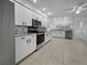 Modern kitchen with stainless steel appliances and white cabinets at 7526 Fairlinks Ct, Sarasota, FL 34243