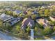 An aerial shot showcases the well-maintained property and mature landscaping located in a desirable neighborhood at 11909 Mandevilla Ct, Tampa, FL 33626