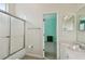 Bright bathroom featuring a shower-tub combo and a single-sink vanity with modern fixtures at 11909 Mandevilla Ct, Tampa, FL 33626
