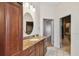 Bathroom features a granite countertop, custom cabinets and access to the walk-in closet at 11909 Mandevilla Ct, Tampa, FL 33626