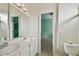 Bright bathroom with double sinks, mirror and toilet at 11909 Mandevilla Ct, Tampa, FL 33626