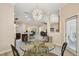 Bright breakfast nook adjacent to the kitchen, showcasing a view into the expansive open floor plan at 11909 Mandevilla Ct, Tampa, FL 33626