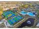 Aerial view of community pool area with tennis and pickleball courts at 11909 Mandevilla Ct, Tampa, FL 33626