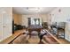 Spacious game room with a billiard table, stylish seating, and ample natural light at 11909 Mandevilla Ct, Tampa, FL 33626