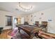 Entertainment room with pool table, warm lighting, and an inviting atmosphere for social gatherings at 11909 Mandevilla Ct, Tampa, FL 33626