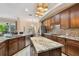 Large kitchen with granite countertops, central island, stainless appliances, and view to the breakfast nook at 11909 Mandevilla Ct, Tampa, FL 33626
