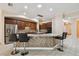 Kitchen featuring stainless steel appliances, bar seating at the island and tile backsplash at 11909 Mandevilla Ct, Tampa, FL 33626