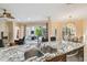 Kitchen featuring a granite counter island with sink and chairs, offering a view to the patio and backyard at 11909 Mandevilla Ct, Tampa, FL 33626