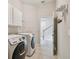 Functional laundry room with modern washer and dryer at 11909 Mandevilla Ct, Tampa, FL 33626