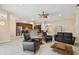 Open-concept living room featuring sleek floors, neutral tones, and seamless flow to a modern kitchen at 11909 Mandevilla Ct, Tampa, FL 33626