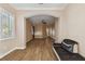 Spacious living room showcasing wood-look flooring and a leather couch at 11909 Mandevilla Ct, Tampa, FL 33626