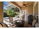 Delightful screened-in patio boasts pool, hot tub, grill, and comfortable outdoor furniture at 11909 Mandevilla Ct, Tampa, FL 33626