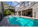 Enjoy the luxury of this private pool and spa on a spacious screened lanai at 11909 Mandevilla Ct, Tampa, FL 33626