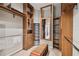 Well-organized walk-in closet with custom built-in shelves, drawers, and mirror at 11909 Mandevilla Ct, Tampa, FL 33626