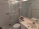 Updated bathroom with glass shower doors, vanity, toilet, and sink at 642 Bird Bay E Dr # 205, Venice, FL 34285