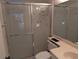 Clean bathroom featuring glass shower doors, vanity, and updated sink at 642 Bird Bay E Dr # 205, Venice, FL 34285