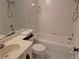 Bathroom features white tile, tub, toilet, and vanity with sink at 642 Bird Bay E Dr # 205, Venice, FL 34285