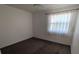 Bright bedroom with neutral carpet, ceiling fan, and sheer curtains on the window at 642 Bird Bay E Dr # 205, Venice, FL 34285