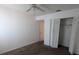 Bedroom with neutral carpet, ceiling fan, and closet with bi-fold doors at 642 Bird Bay E Dr # 205, Venice, FL 34285