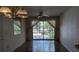 Bright living room with hardwood floors, and a sliding glass door offering view of the landscaped greenery at 642 Bird Bay E Dr # 205, Venice, FL 34285