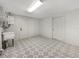 Bright laundry room with patterned tile floor and built-in shelving at 290 Dragon Rd, Venice, FL 34293
