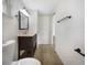 Updated bathroom with dark vanity and tile flooring at 290 Dragon Rd, Venice, FL 34293