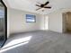 Large bedroom with plush carpeting and access to the backyard at 4143 Waikiki Dr, Sarasota, FL 34241
