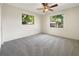 Cozy bedroom featuring gray carpeting and large windows at 4143 Waikiki Dr, Sarasota, FL 34241