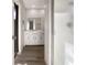 Modern bathroom with white vanity and a walk-in shower at 4143 Waikiki Dr, Sarasota, FL 34241
