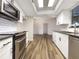 Updated kitchen with white cabinets, stainless steel appliances and subway tile backsplash at 4143 Waikiki Dr, Sarasota, FL 34241