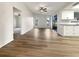 Open living space with wood-look floors and access to kitchen at 4143 Waikiki Dr, Sarasota, FL 34241