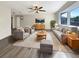 Bright and airy living room with hardwood floors, modern furniture, and large windows at 4143 Waikiki Dr, Sarasota, FL 34241