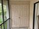 White double doors leading to a storage closet at 642 Bird Bay E Dr # 205, Venice, FL 34285
