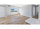 Bright living room with wood-look floors and access to balcony at 3315 58Th S Ave # 508, St Petersburg, FL 33712