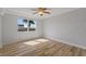 Bedroom with large windows and light wood-look floors at 3315 58Th S Ave # 508, St Petersburg, FL 33712