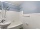Clean bathroom with white tiled walls and a tub shower at 3315 58Th S Ave # 508, St Petersburg, FL 33712