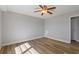 Bright bedroom with wood-look floors and ceiling fan at 3315 58Th S Ave # 508, St Petersburg, FL 33712