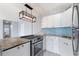 Modern kitchen with granite countertops and stainless steel appliances at 3315 58Th S Ave # 508, St Petersburg, FL 33712