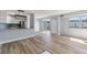 Bright living room with kitchen, light flooring, and balcony access at 3315 58Th S Ave # 508, St Petersburg, FL 33712