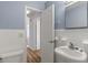 Simple bathroom with white tiled walls and a vanity at 3315 58Th S Ave # 508, St Petersburg, FL 33712